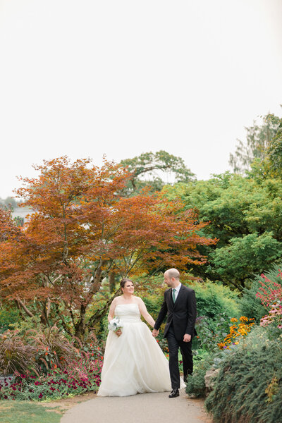 Bride and groom under wedding veil in Vancouver