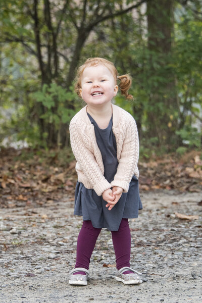 Girl cheesing Biltmore Estate Asheville NC family photos