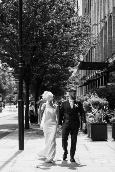 Bride and Groom walking through London