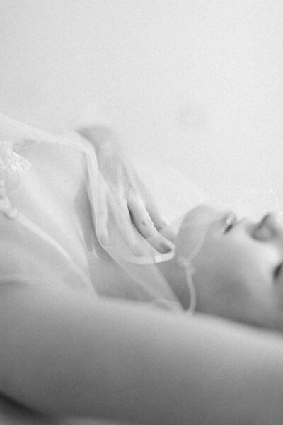 natural portrait of a woman with long brown hair wearing a nude slip