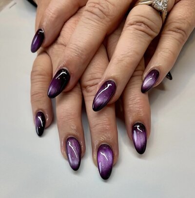 Purple chrome manicure photographed at Maven + Grace Salon in McMinnville, Oregon, showcasing high-shine nail artistry