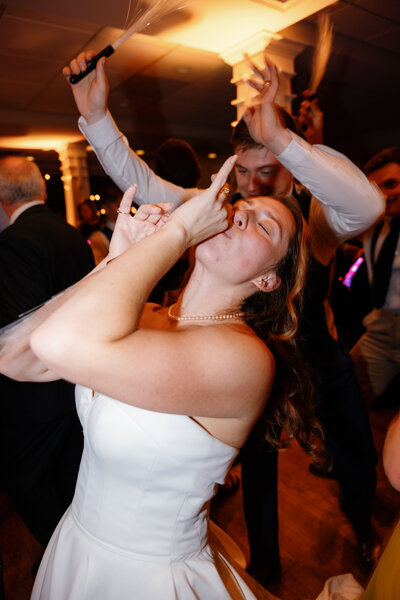 A couple with their arms around each other about to kiss