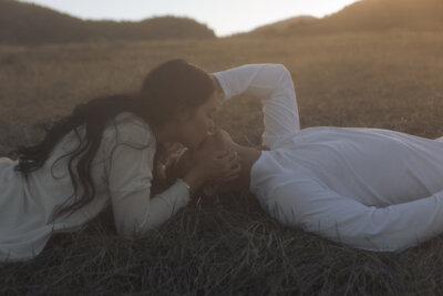 couple laying in grass