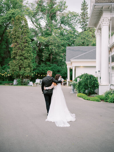 bride and groom in front of norland historic estate