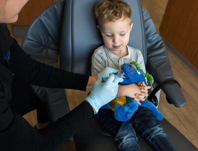 Happy child receiving dental care from a friendly pediatric dentist at Gateway Pediatric Dentistry.