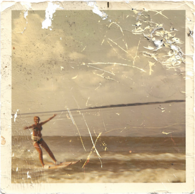 a woman waterskiing on a lake. 