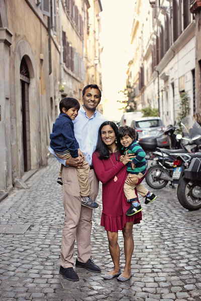 Family of 4  laughing on the streets of Monti. Taken by Rome Family Photographer, Tricia Anne Photography