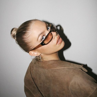 Stylish influencer posing for the camera, emphasizing fashion branding and content creation, developed by Muse Studio for influencer marketing campaigns.