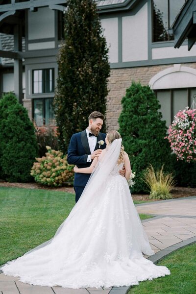 Groom sees bride for the first time during their intimate wedding at Deer Creek in Ajax, captured by Toronto wedding photographer