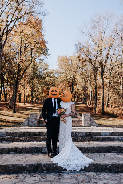 Destination Elopement Photographer captures couple in pumpkin heads at their nashville halloween elopement