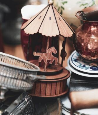 a pile of antique items sitting on top of a table