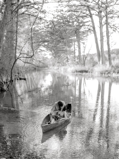 black and white engagement photo on lake