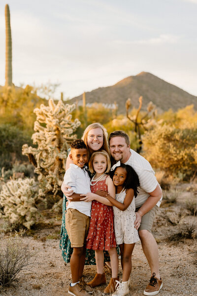 blended family of five pose in arizona landscape