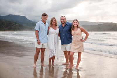 Family smiling on Hawaii beach