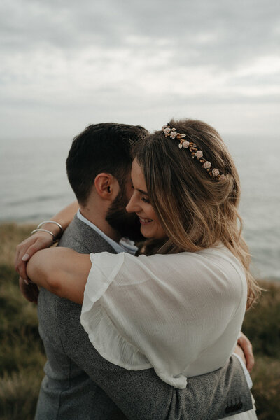 couple embracing at their flinder elopement in the mornington peninsula