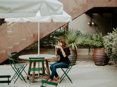 Woman sitting and drinking coffee