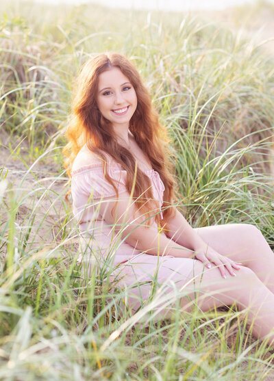 Senior girl in dress in a field