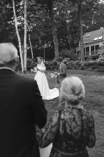 parents watching their daughter get married