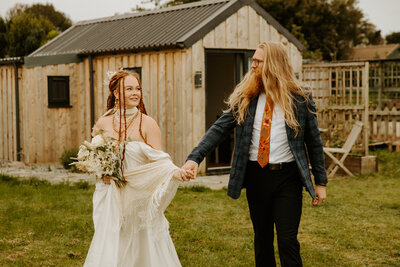 Bride walking alone on forest trail during scotland elopement