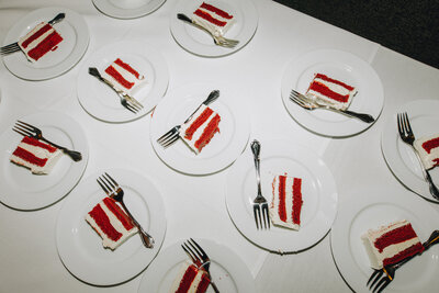 Flash photo of slices of red velvet cake on a table