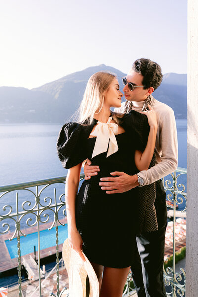 Lake como elopement, couple standing on balcony at hotel grand tremezzo bu White Orchid Photography, destination wedding photographer