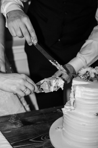 couple cutting wedding cake