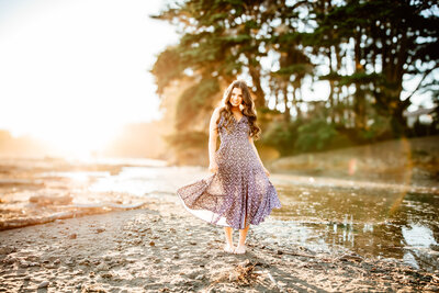 Backlit senior girl on the beach for a san luis obispo photographer senior session. 