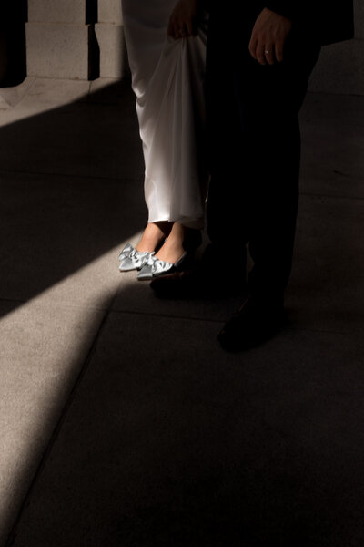 bride-and-grooms-shoes-in-the-shadow