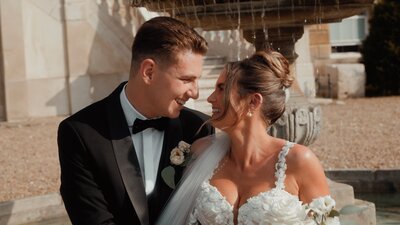 Bride and Groom sharing a laugh on their wedding day. Captured by Wedding Videographer in the UK, HC VIsuals.