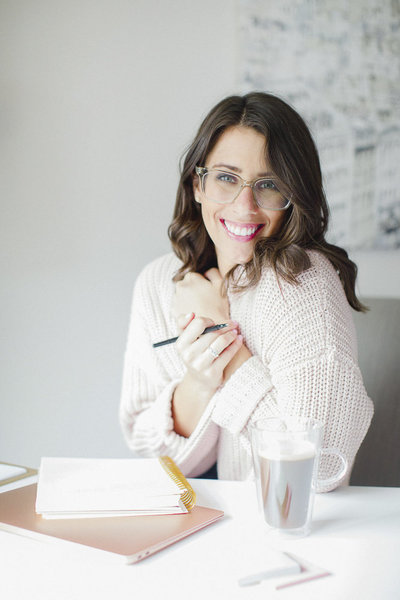 virtual assistant for travel professionals cozy in pink sweater