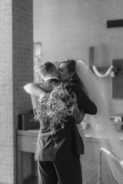 bride and groom embracing