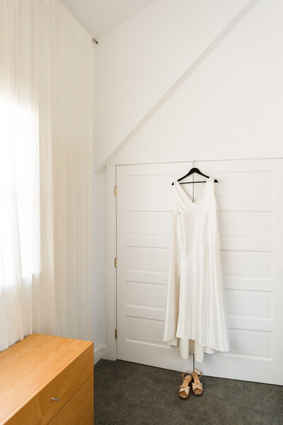 minimalist wedding dress getting ready room