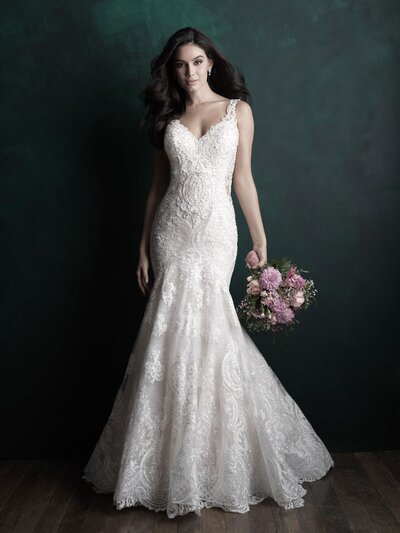 Elegant beadwork tops the bodice of this strapless fit and flare gown.