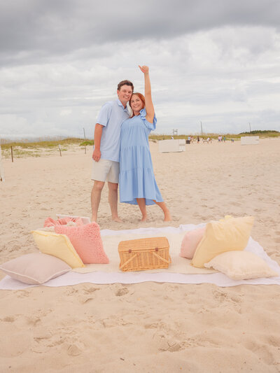 Young couple showing off the ring after saying Yes to a surprise proposal