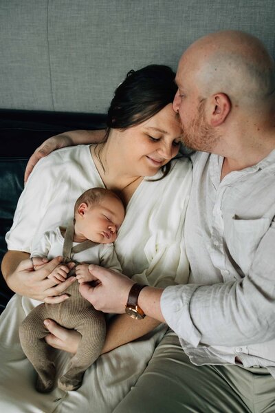 Baby being held in Mum's arms while dad holds her,, maternity photography Melbourne, And So I Don't Forget Photography