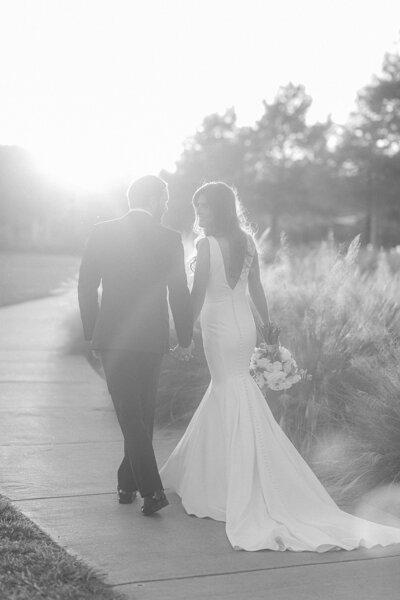 Bride and groom walk up memorial steps at their DC wedding