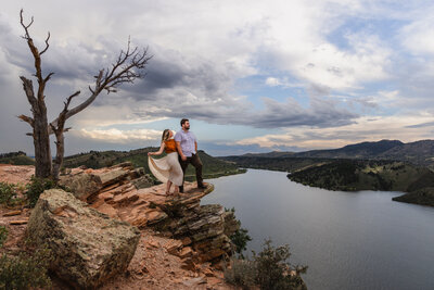 couple standing on the cliffs in colorado taken by Minnesota wedding photographer Marcus Hanenburg Photography
