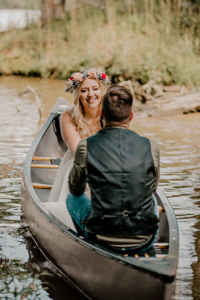 bride and groom going on a canoe ride