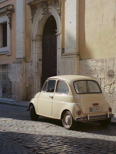 Charming European street scene with a small car nestled among historic buildings. Tailored Oasis Travel Co.