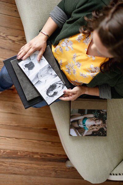 hands going through photo album 