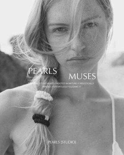 A woman with windblown hair, wearing a white top with a braided hairstyle, overlaid with text that reads 'PEARLS MUSES' and brand descriptors like 'Holistically Minded' and 'Effortlessly Elegant' all in black and white