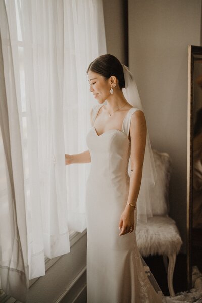 bride looking out a window