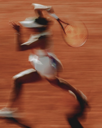 Athlete playing tennis outdoors with improved mobility and reduced pain after acupuncture treatment