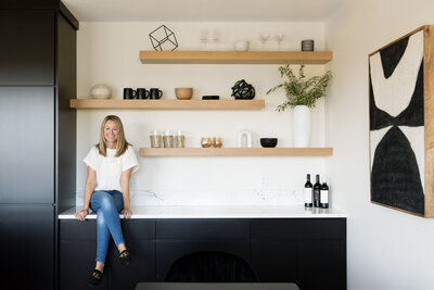casual newborn baby photography on white bedspread window light