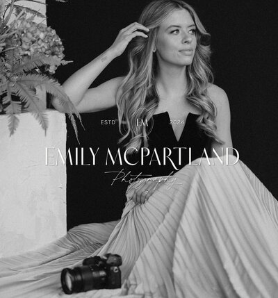 Logo design for Emily McPartland Photography, a wedding photographer. Her luxury logo is overlayed on top of a black and white portrait of herself.