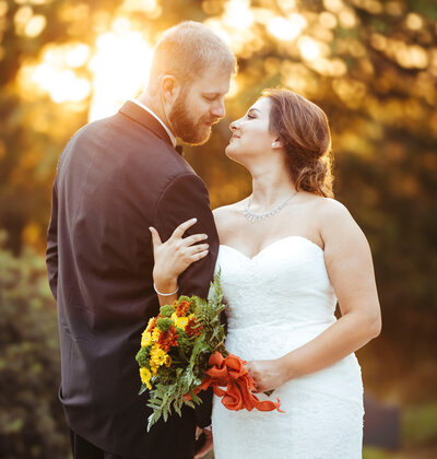 Bride and groom sharing a romantic moment at sunset | Inn at Barley Sheaf Farm Wedding | Holicong, Pennsylvania