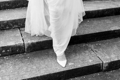 Artistic shot of bride’s dress flowing down stairs, exemplifying Santa Barbara Wedding Photography elegance.