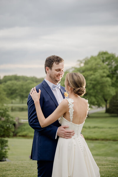 Caleigh and Keiran looking at each other at Elbow Country Club