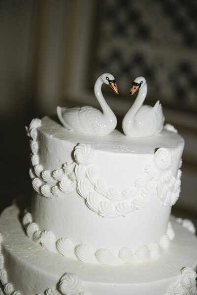 swans on top of wedding cake