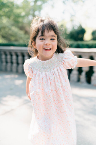 Classic Children’s Portrait – Vintage-Inspired in a Garden
A vintage-inspired portrait of a young child in a timeless outfit, seated in a blooming garden, captured in the signature style of Iris Graciela, South Jordan Newborn Photographer.